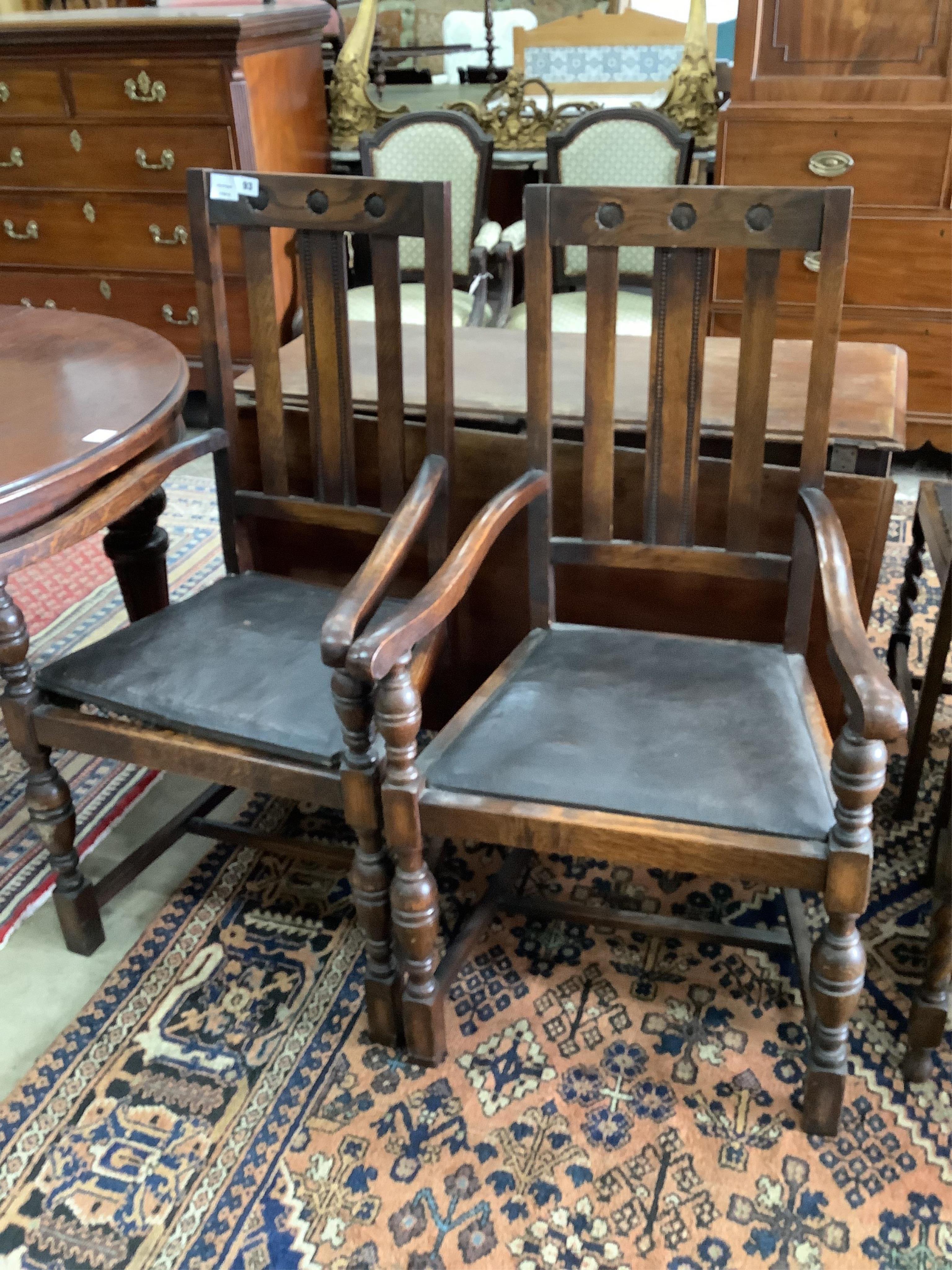 Eight 1920's oak dining chairs, two with arms